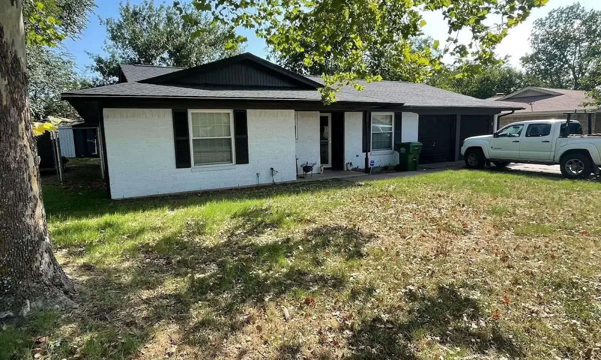 Professional roofing crew working on a residential roof in University of California-Davis